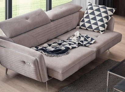 Luxurious, fashionable two-seater sofa with textile upholstery on high legs